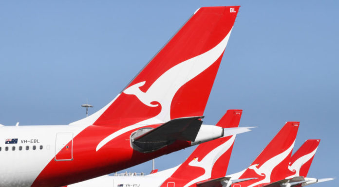 Qantas flags $1.1 billion first-half loss